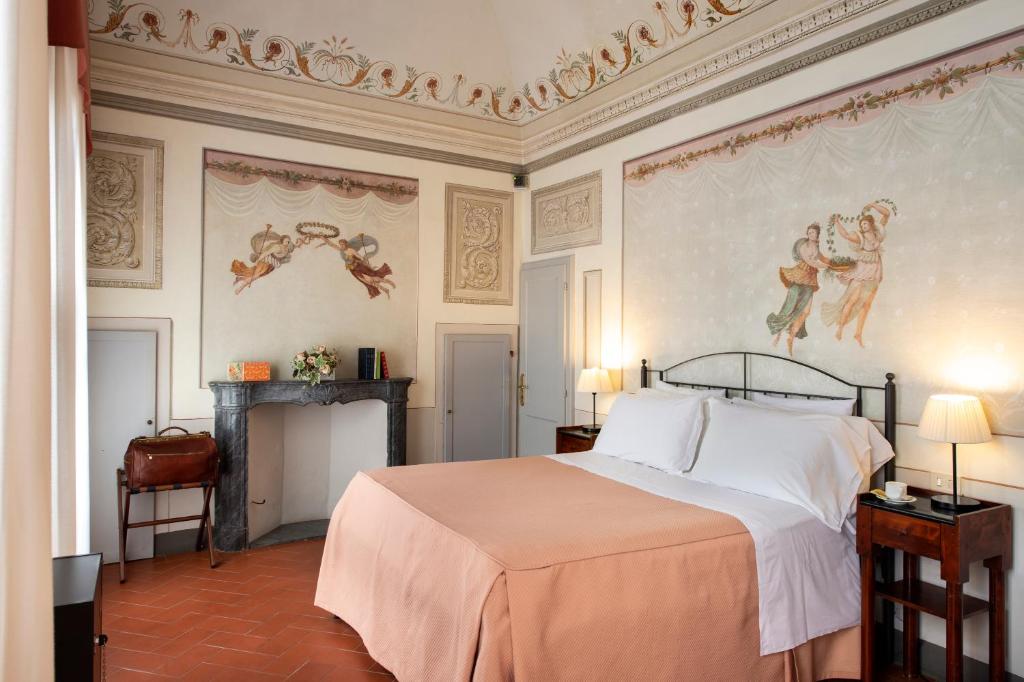 Postel nebo postele na pokoji v ubytování Hotel L'Antico Pozzo