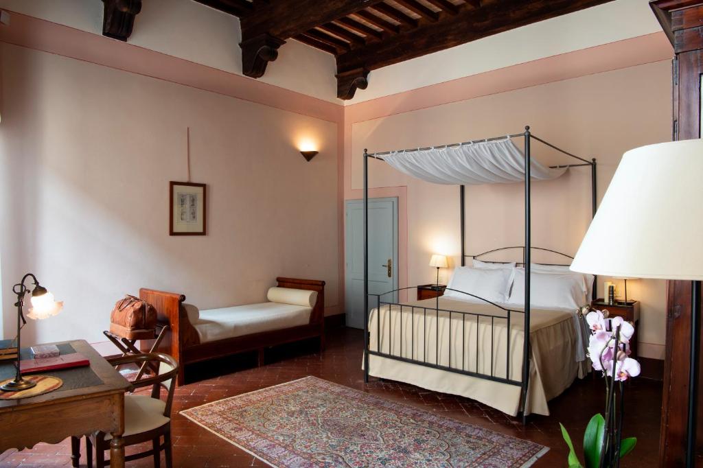 Postel nebo postele na pokoji v ubytování Hotel L'Antico Pozzo