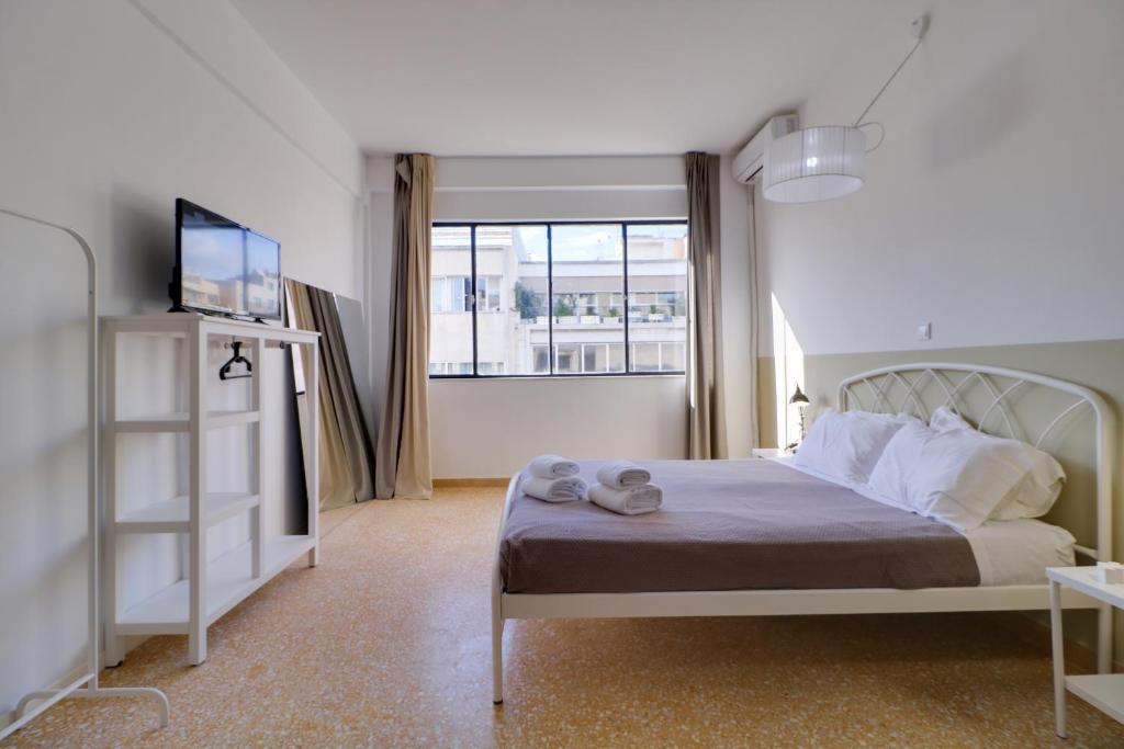 Posteľ alebo postele v izbe v ubytovaní athens.apartotel.1