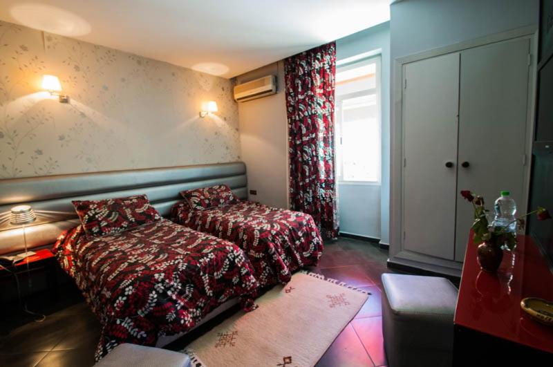 Postel nebo postele na pokoji v ubytování Hotel De La Paix