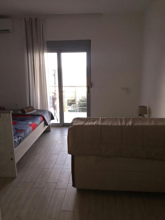 Łóżko lub łóżka w pokoju w obiekcie Apartment Sorelle