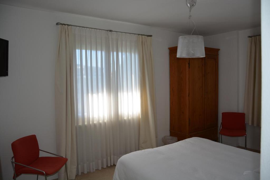 Postel nebo postele na pokoji v ubytování Hotel Villa Selva