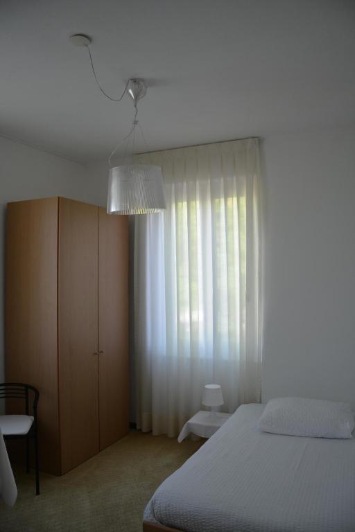 Postel nebo postele na pokoji v ubytování Hotel Villa Selva