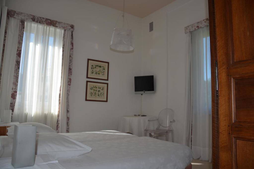 Postel nebo postele na pokoji v ubytování Hotel Villa Selva