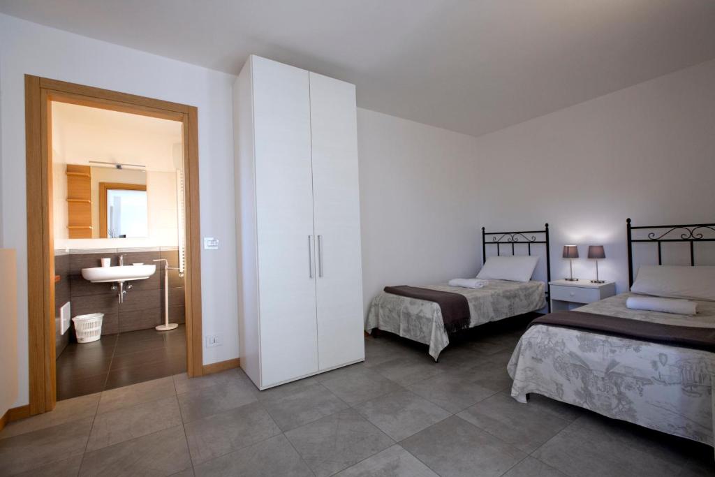 Postel nebo postele na pokoji v ubytování Agriturismo Mestroni