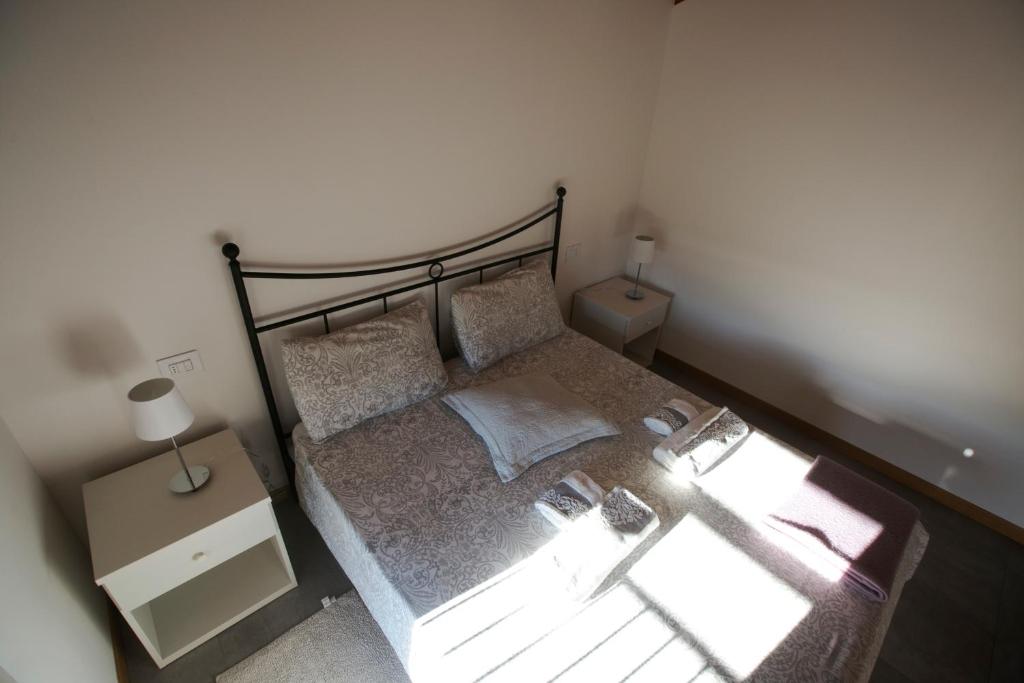 Postel nebo postele na pokoji v ubytování Agriturismo Mestroni