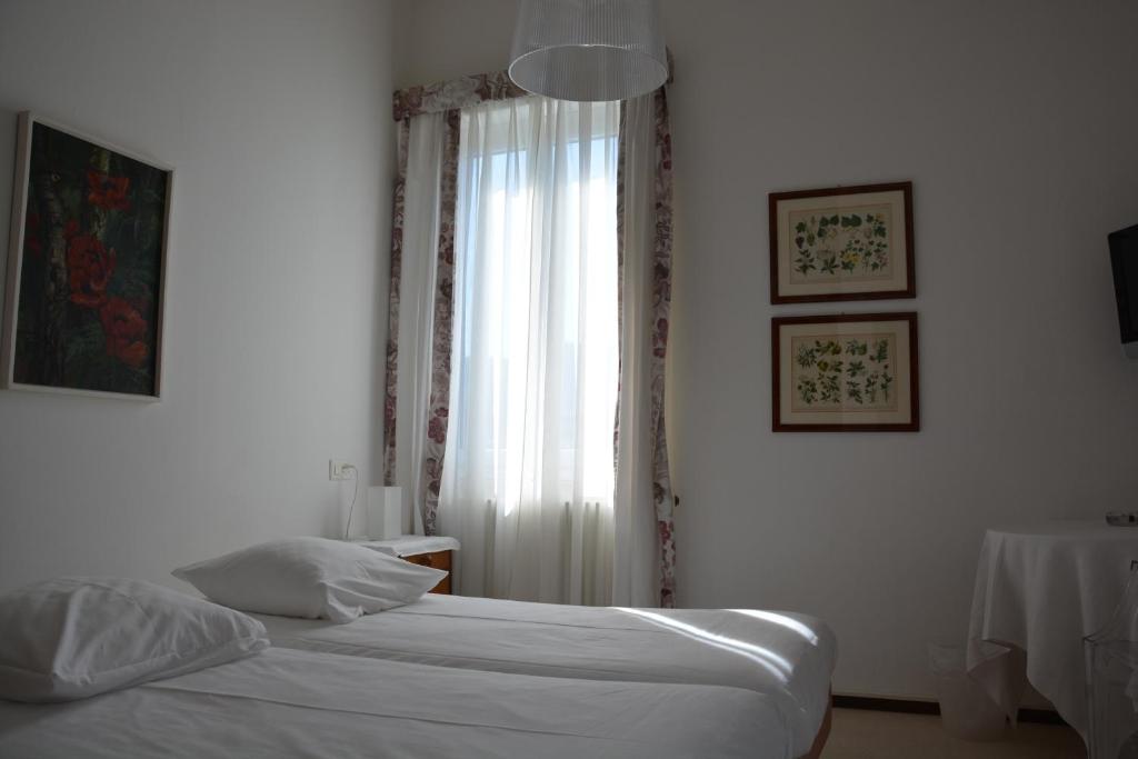 Postel nebo postele na pokoji v ubytování Hotel Villa Selva