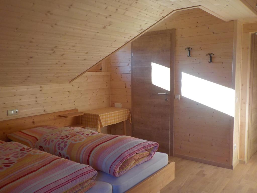 Postel nebo postele na pokoji v ubytování Berghütte Plafötschalm