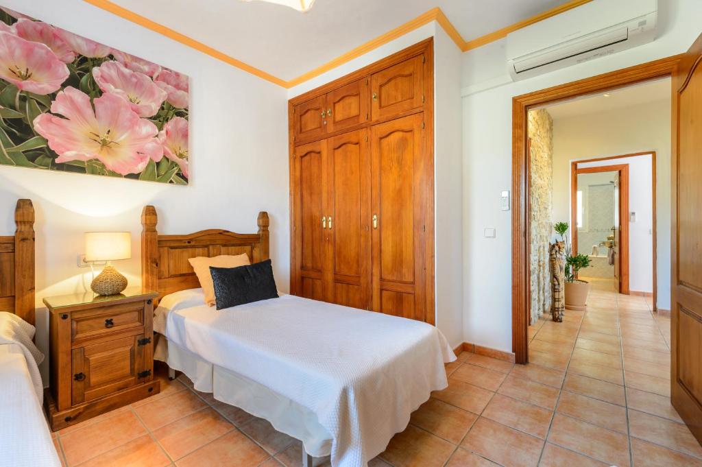 Postel nebo postele na pokoji v ubytování Villa Can Ameler