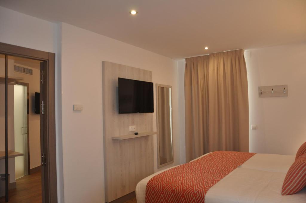 Postel nebo postele na pokoji v ubytování Hotel Selu