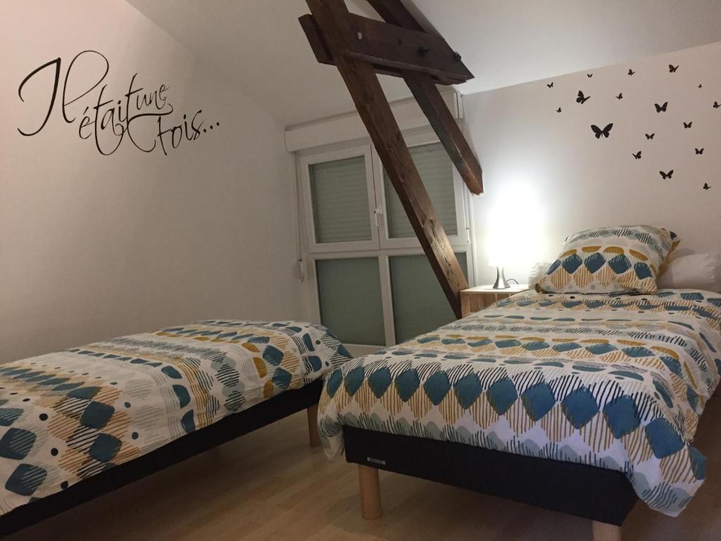Postel nebo postele na pokoji v ubytování Gîtes d'Olbiche