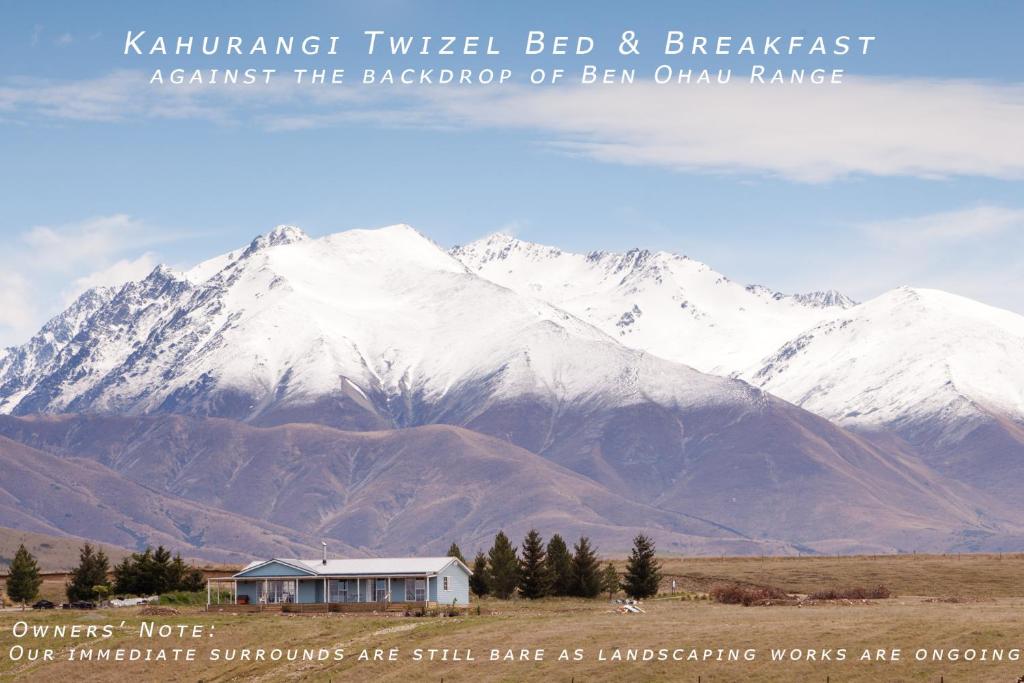 a house in front of a snow covered mountain at Kahurangi Twizel Hosted Bed & Breakfast in Twizel