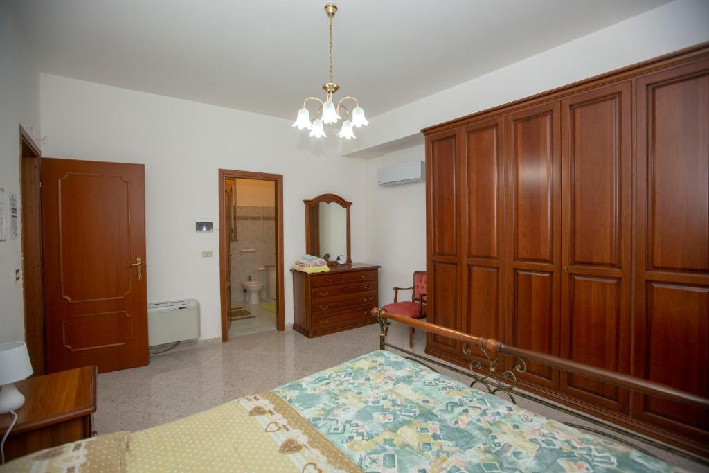 Postel nebo postele na pokoji v ubytování Rosa di Calabria