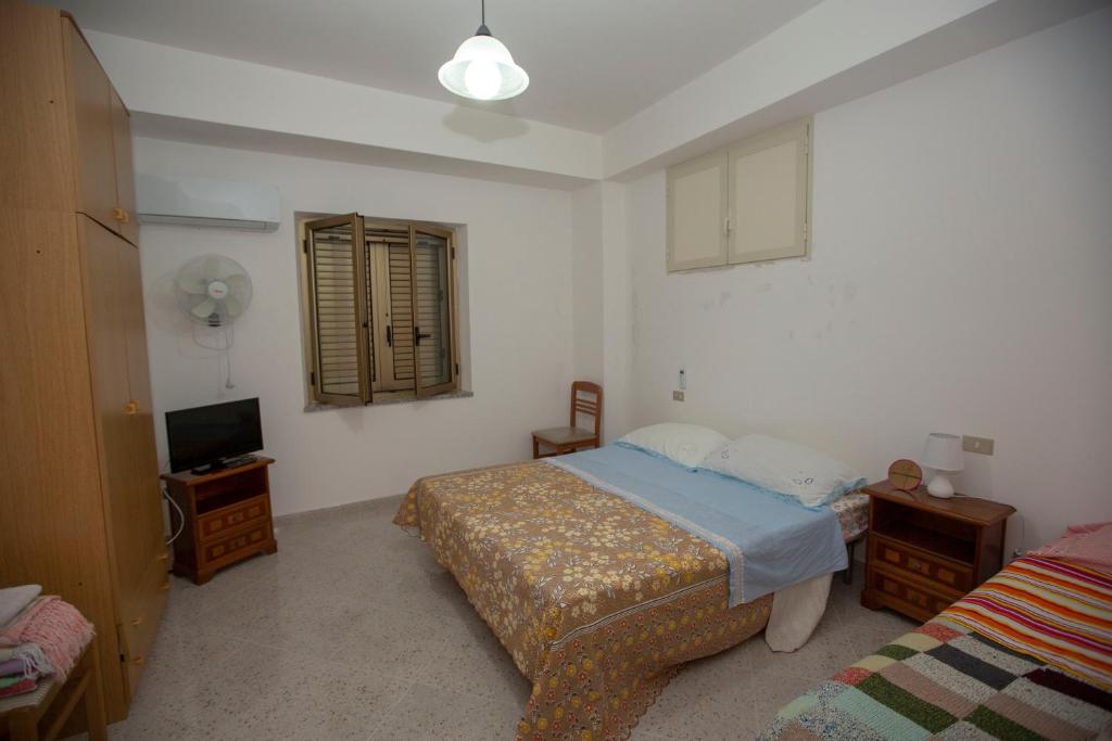 Postel nebo postele na pokoji v ubytování Rosa di Calabria