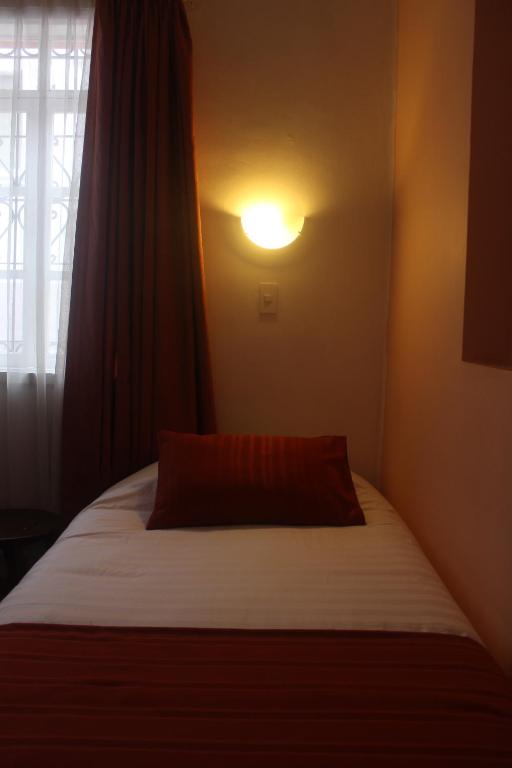Postel nebo postele na pokoji v ubytování Hotel Andino