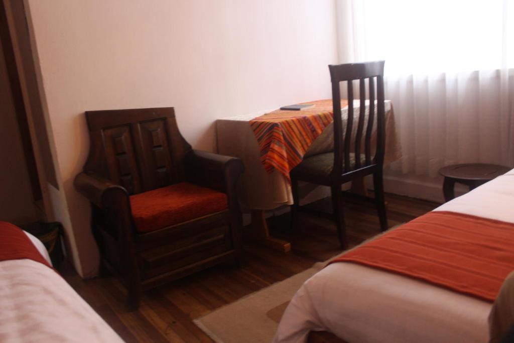 Postel nebo postele na pokoji v ubytování Hotel Andino