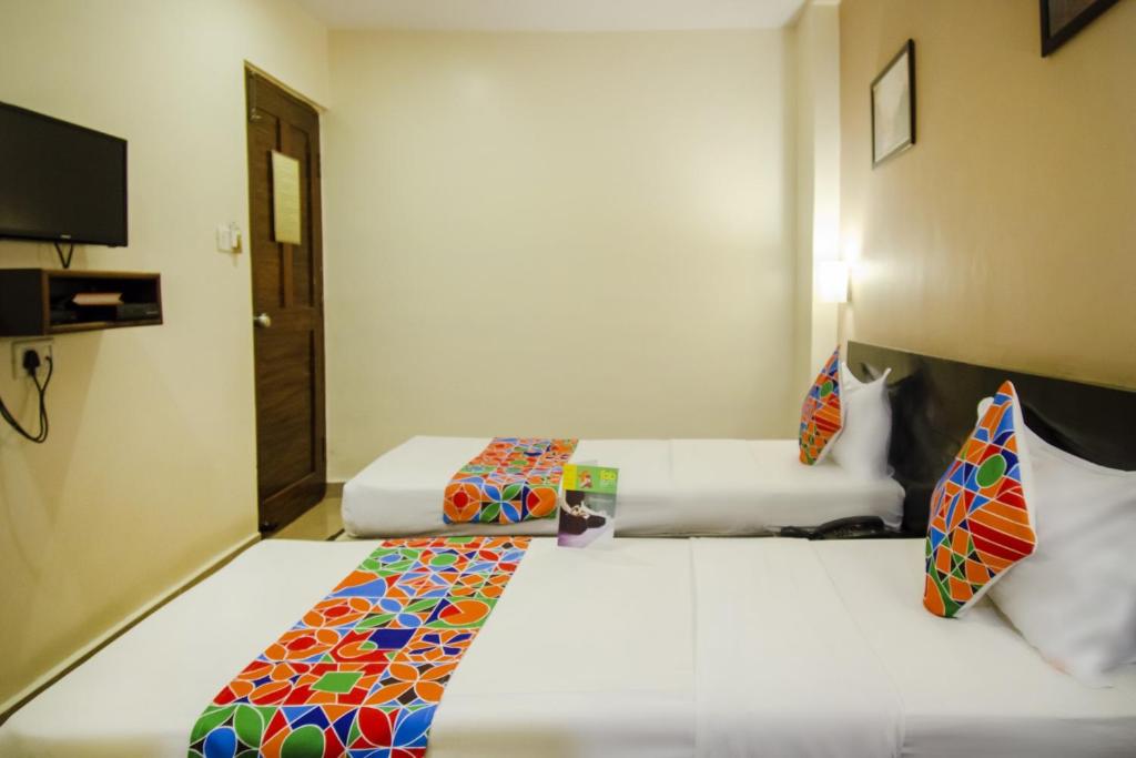 Postel nebo postele na pokoji v ubytování Hotel Sunshine