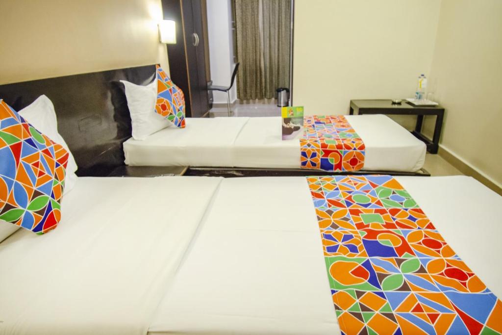 Postel nebo postele na pokoji v ubytování Hotel Sunshine
