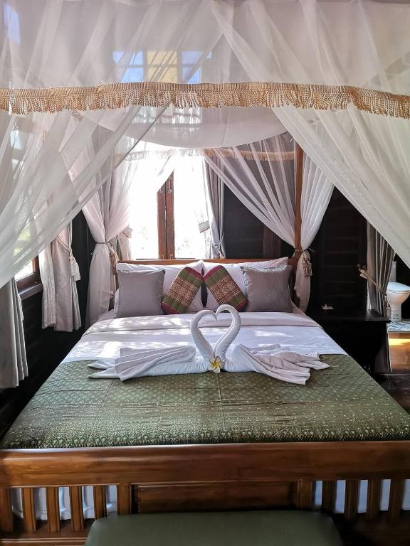 Katil atau katil-katil dalam bilik di Baan Sithepaban Guesthouse