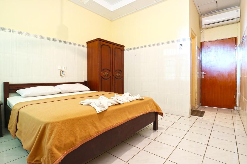 Postel nebo postele na pokoji v ubytování Gora Beach Inn