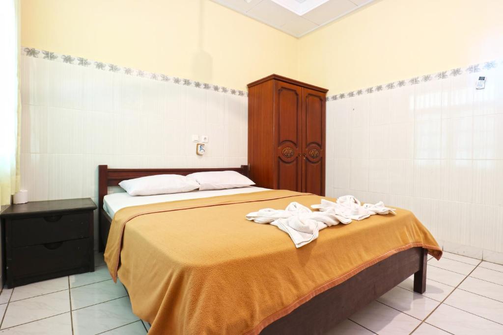 Postel nebo postele na pokoji v ubytování Gora Beach Inn