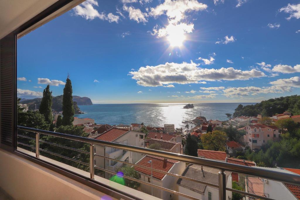 a view of the ocean from a balcony at Apartment Sidro in Petrovac na Moru