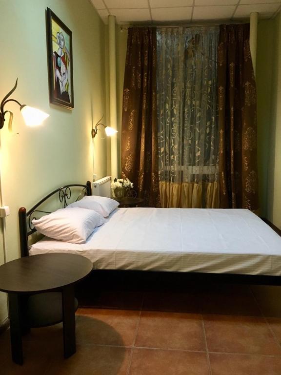 Postel nebo postele na pokoji v ubytování hostel Koleso