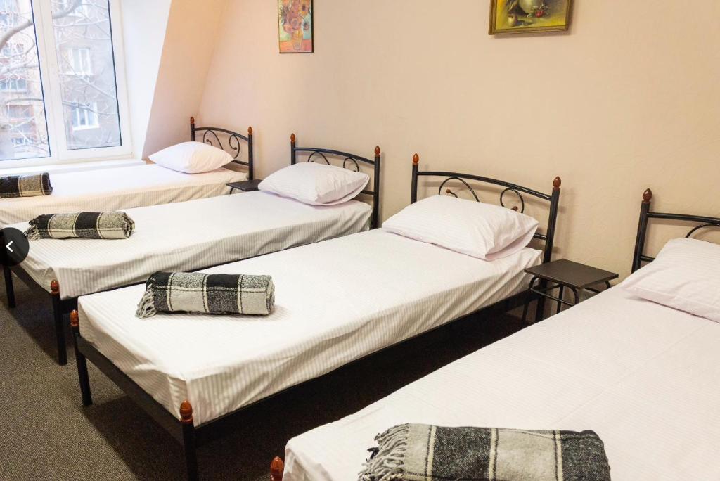 Postel nebo postele na pokoji v ubytování hostel Koleso