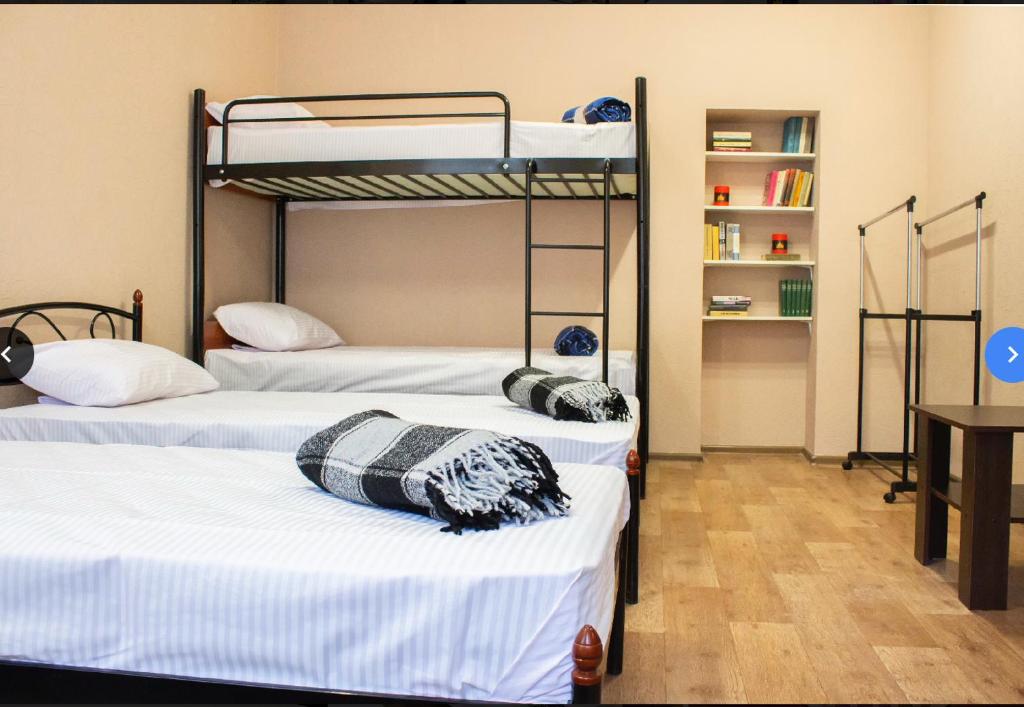 Postel nebo postele na pokoji v ubytování hostel Koleso
