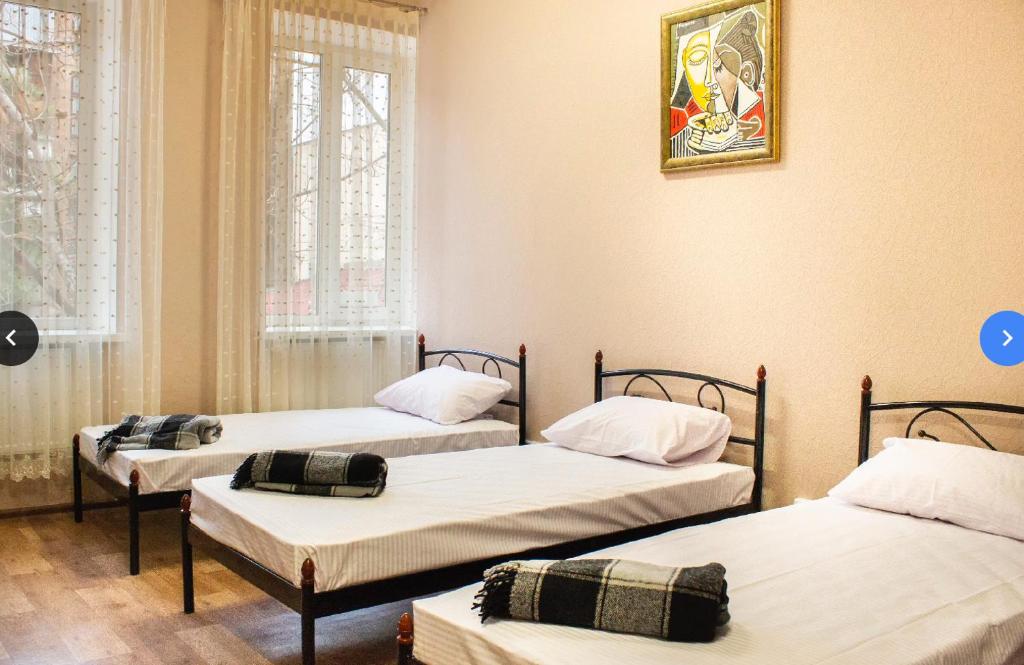 Postel nebo postele na pokoji v ubytování hostel Koleso