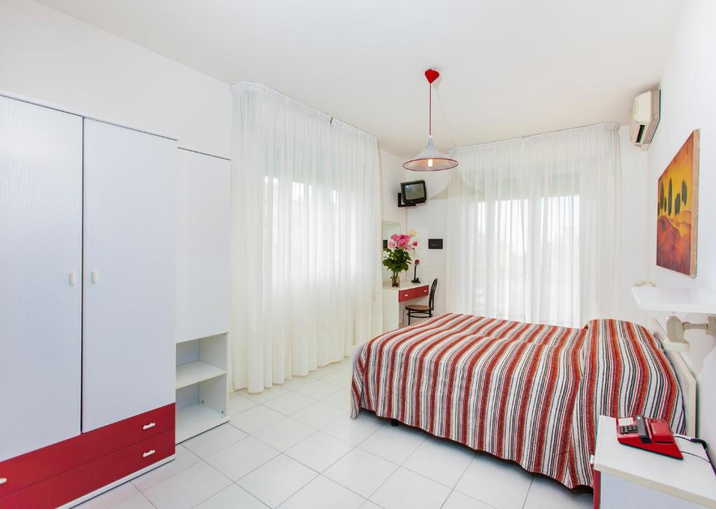 Posteľ alebo postele v izbe v ubytovaní Hotel Wally