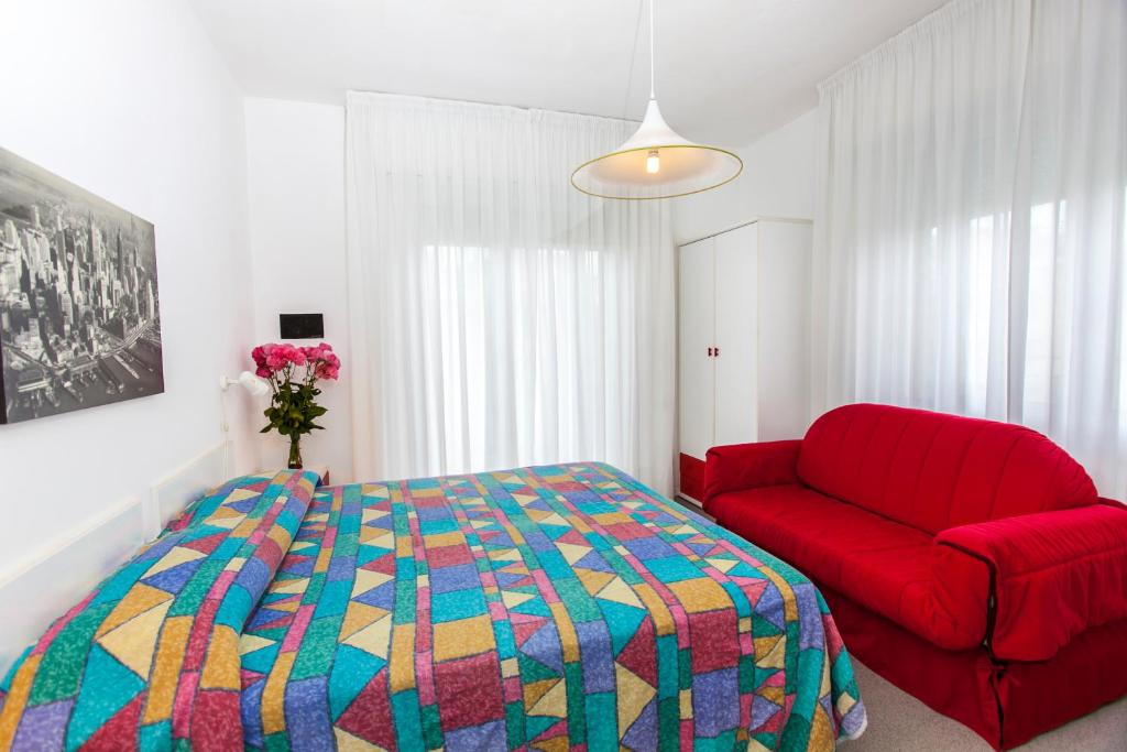Posteľ alebo postele v izbe v ubytovaní Hotel Wally