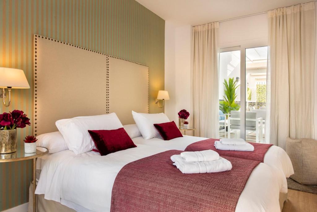 Posteľ alebo postele v izbe v ubytovaní Genteel Home Baños