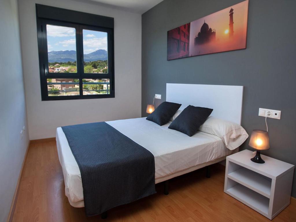 Posteľ alebo postele v izbe v ubytovaní For a Stay Las Dunas