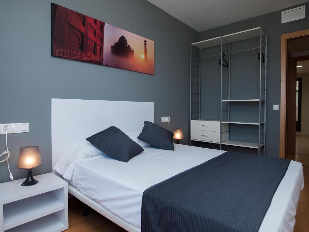 Posteľ alebo postele v izbe v ubytovaní For a Stay Las Dunas