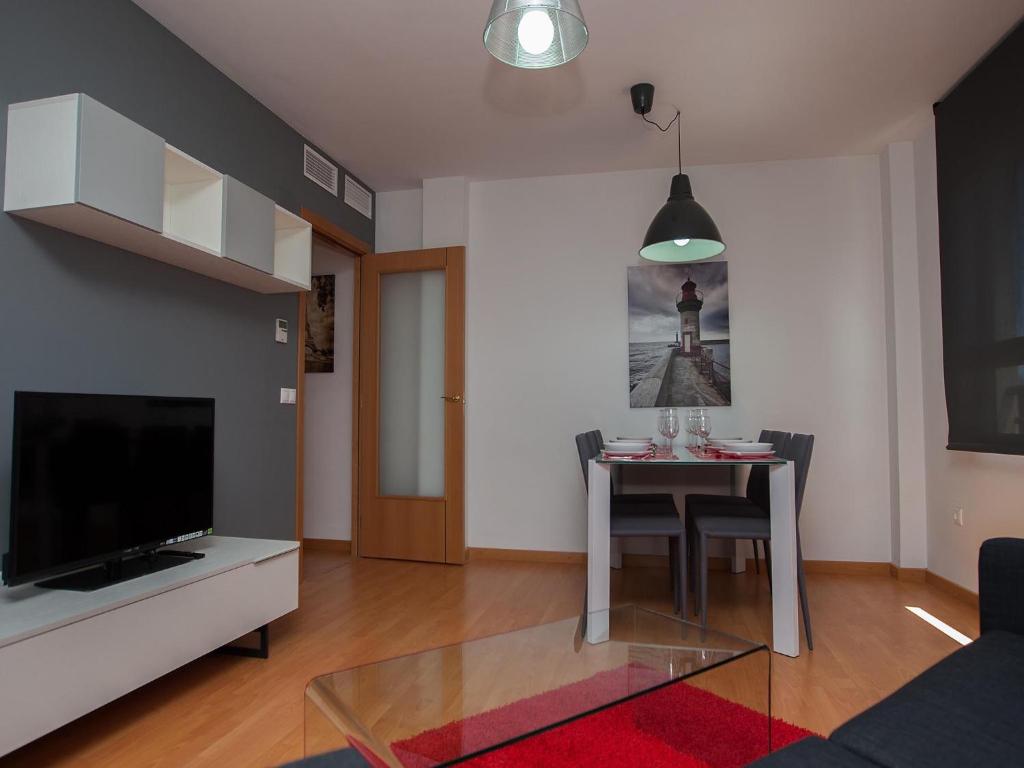 Televízia a/alebo spoločenská miestnosť v ubytovaní For a Stay Las Dunas