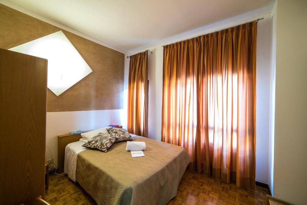 Postel nebo postele na pokoji v ubytování La Vecchia Cartiera