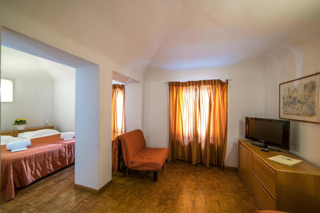 Postel nebo postele na pokoji v ubytování La Vecchia Cartiera
