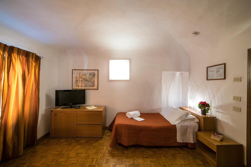 Postel nebo postele na pokoji v ubytování La Vecchia Cartiera