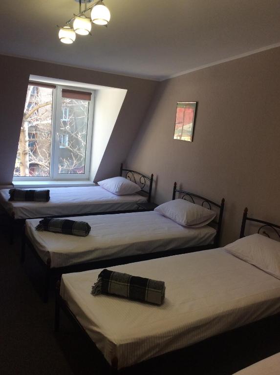 Postel nebo postele na pokoji v ubytování hostel Koleso