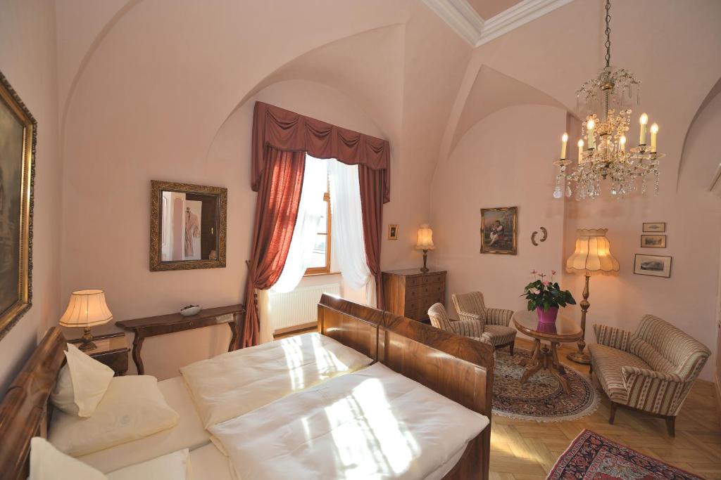 a living room with a couch and a table at Hotel Schloss Dürnstein in Dürnstein