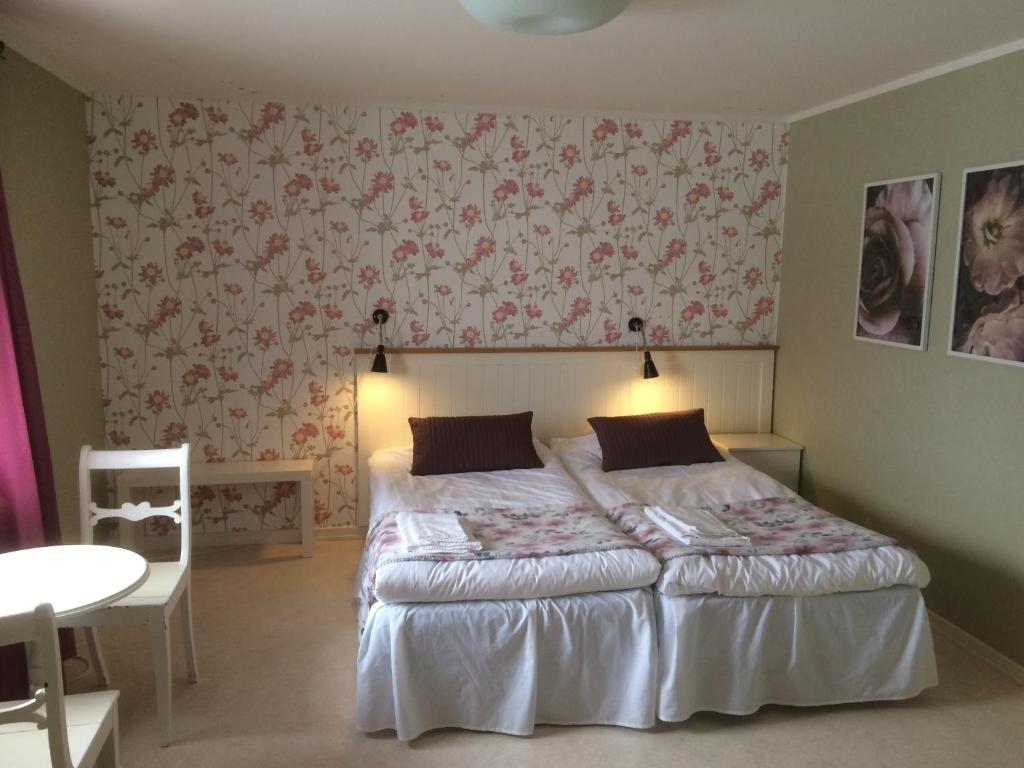 Postel nebo postele na pokoji v ubytování Hotell Paradis