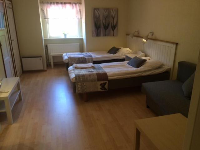 Postel nebo postele na pokoji v ubytování Hotell Paradis
