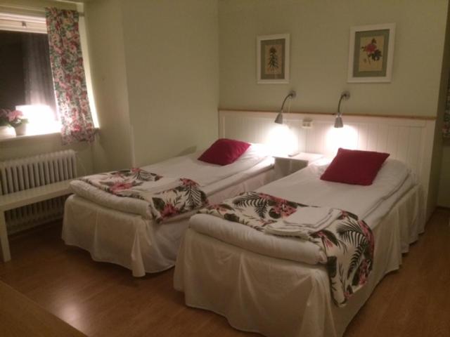 Postel nebo postele na pokoji v ubytování Hotell Paradis