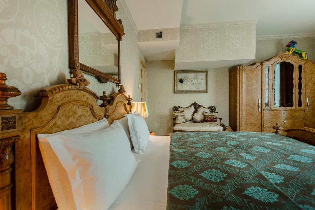 Postel nebo postele na pokoji v ubytování Vinotel Boutique Hotel