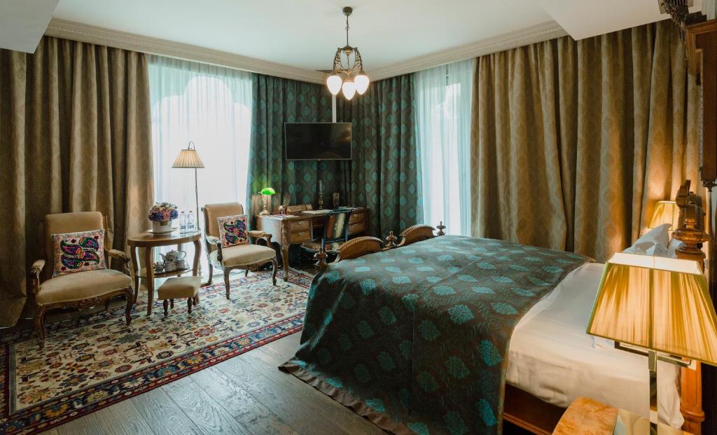 Postel nebo postele na pokoji v ubytování Vinotel Boutique Hotel