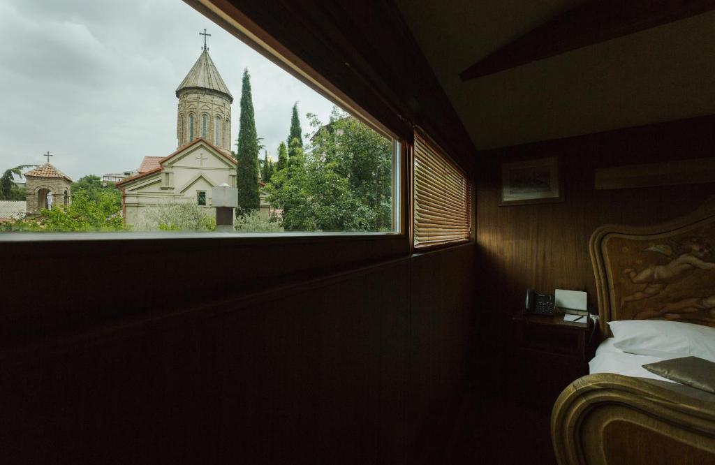 Postel nebo postele na pokoji v ubytování Vinotel Boutique Hotel