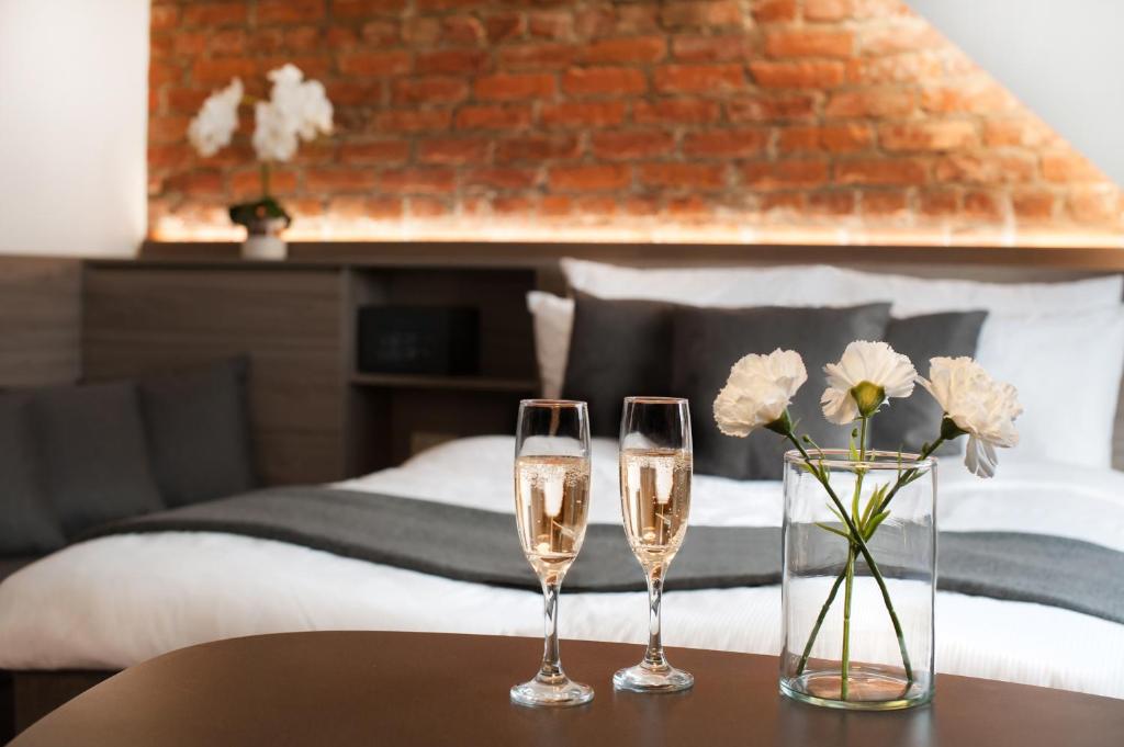 Postel nebo postele na pokoji v ubytování Dangė Hotel