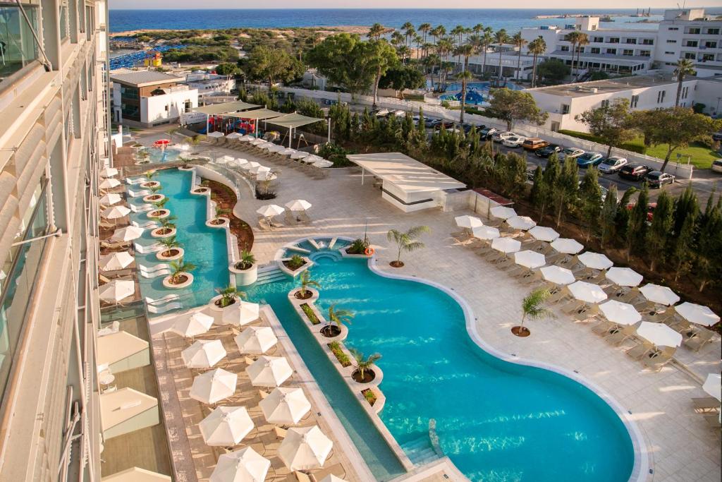 an aerial view of a pool at a resort at Asterias Beach Hotel in Ayia Napa