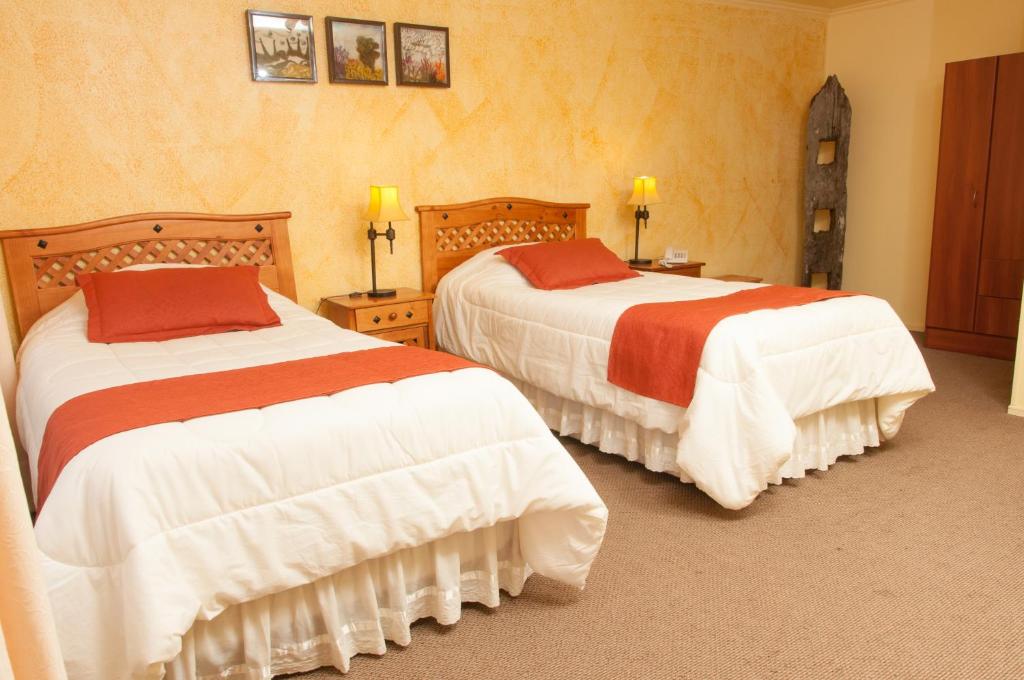 Voodi või voodid majutusasutuse Apart Hotel Blumenau toas